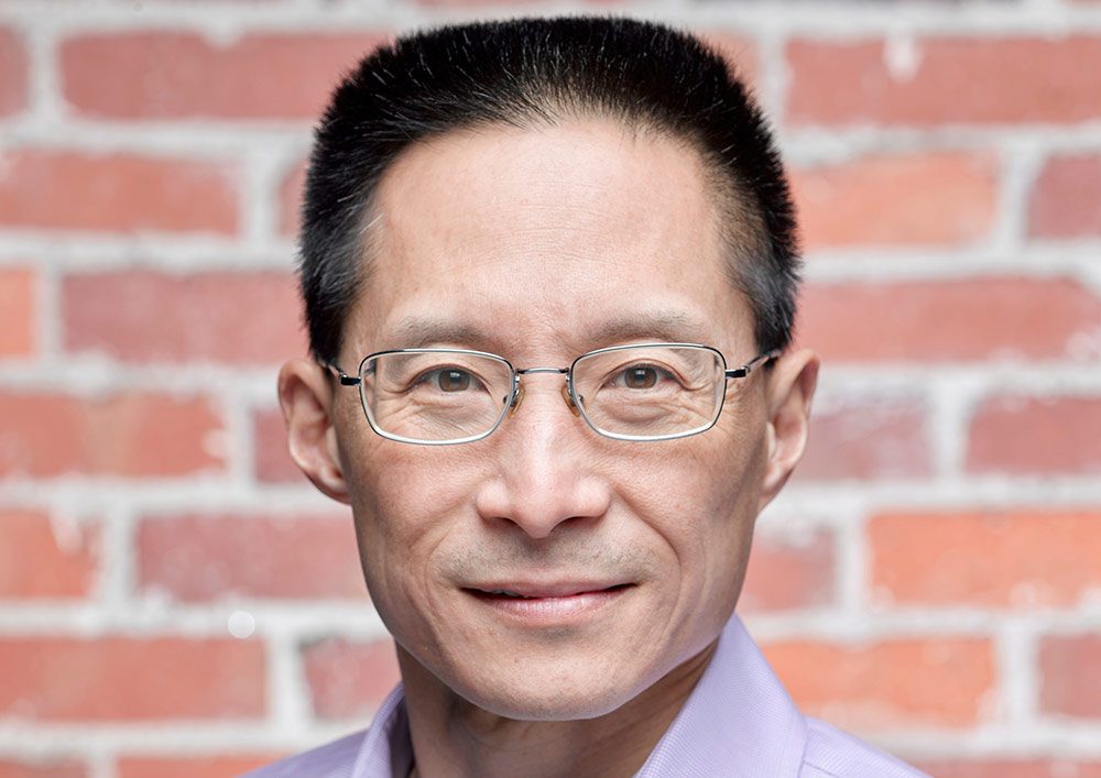 A headshot photo of Eric Liu.