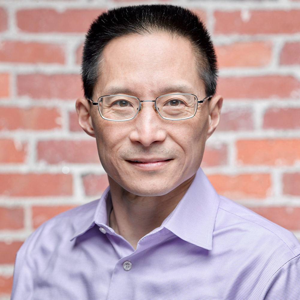 A headshot photo of Eric Liu.