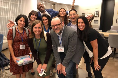 The CU staff standing together and smiling. 